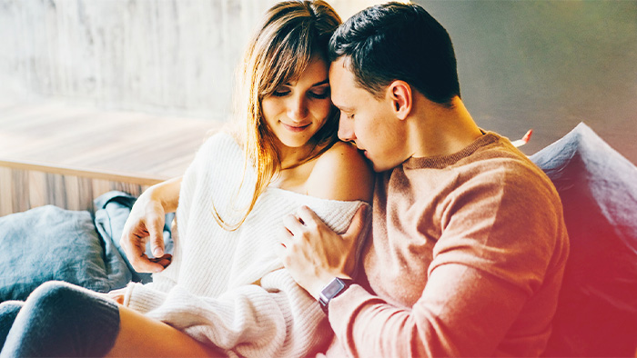 Couple on couch cuffing season