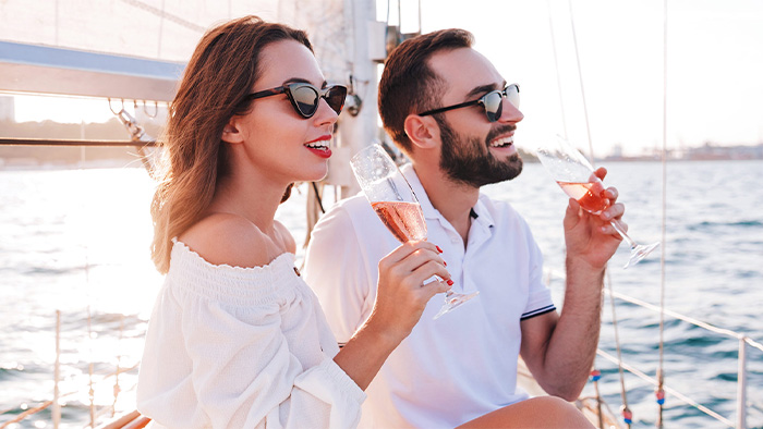 Couple enjoying one of our recommended date night ideas for new couples - the dinner cruise!