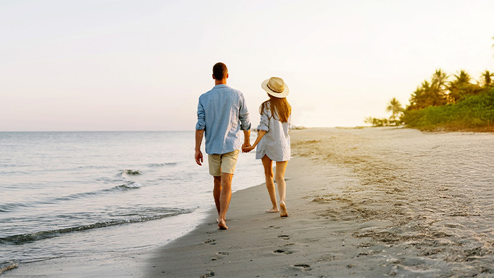 Couple walking on the beach