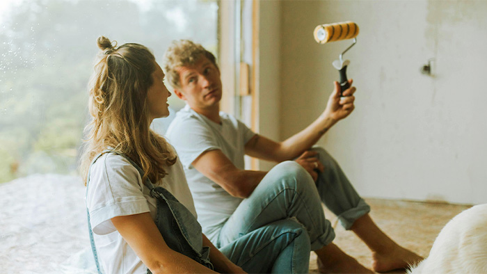 Couple discussing a painting job