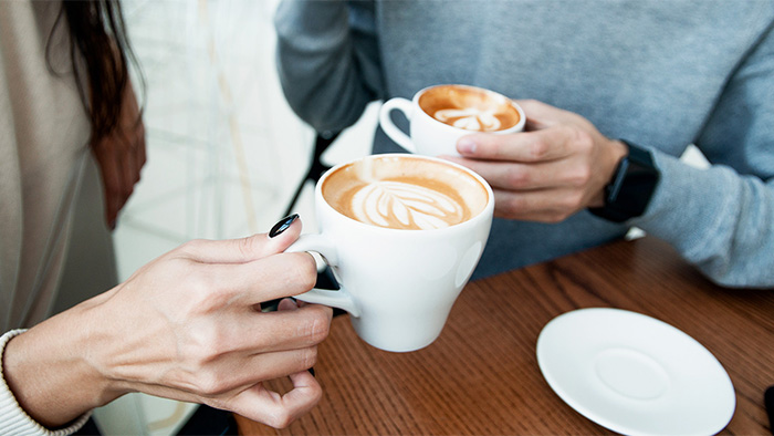 Couple having cappuccinos