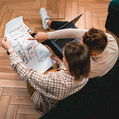 Couple examining blueprints