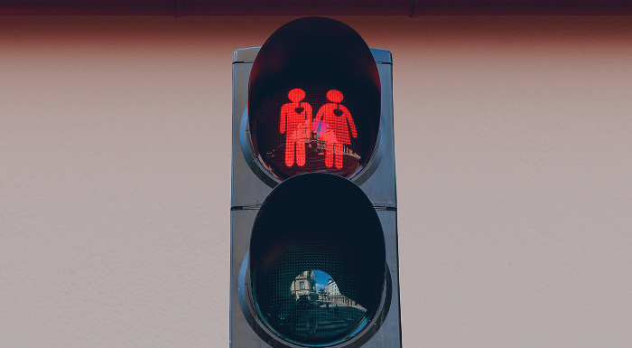 Embossed Red Couple Outline on Stop Light