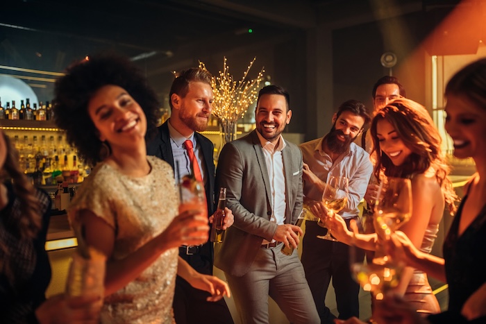 Group of well-dressed men at a party