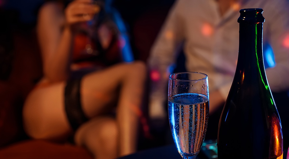 Man with a stripper and champagne