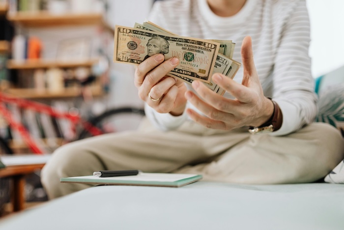 Person holding cash