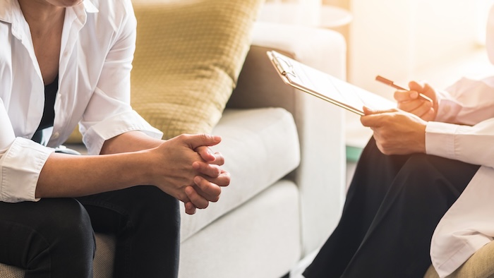 Woman speaking with therapist