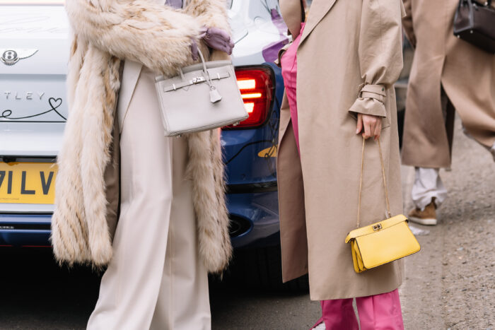 Milan, Italy - February 22, 2023: woman wearing Fendi Peekaboo and Hermes Birkin shoulder bag. Fashion blogger outfit details, street style