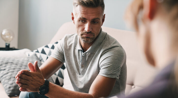 Man on couch in therapy session