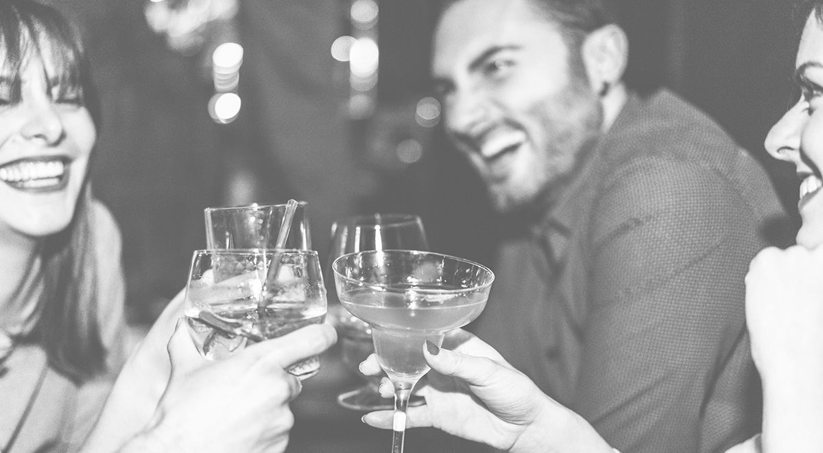 Friends chatting at a bar