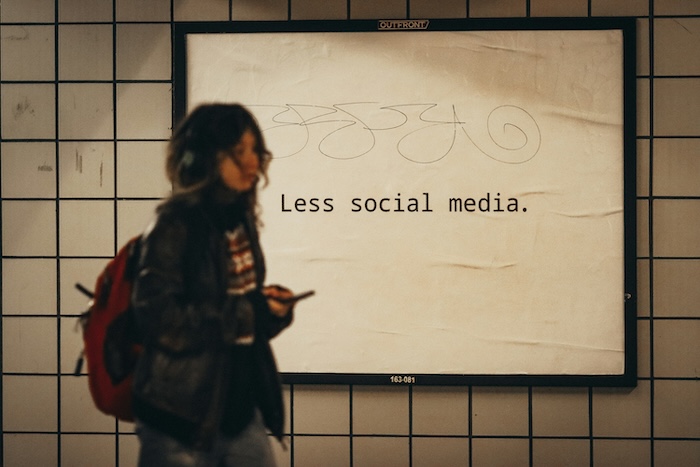 Less Social Media featured on a minimalist advertisement in the subway