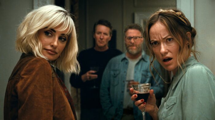 AI-upscaled image of the cast of The Invite sharing a tense, bewildered moment during a social gathering.