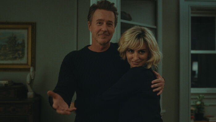 Ed Norton as Hawk and Penélope Cruz as Pina welcome guests into their home in The Invite.