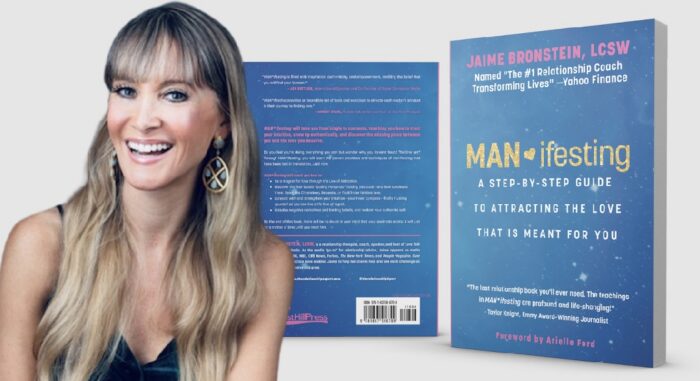 Relationship coach Jaime Bronstein poses beside her book, MANifesting: A Step-by-Step Guide to Attracting the Love That Is Meant for You.